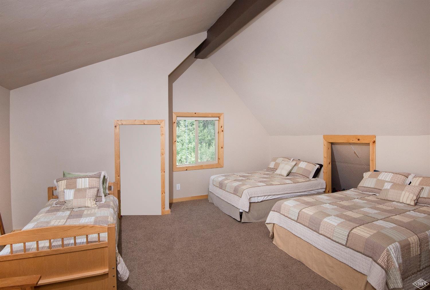 320 Mill Road Eagle, CO 81631 - Photo 14 of 24 a bedroom with two beds and a window