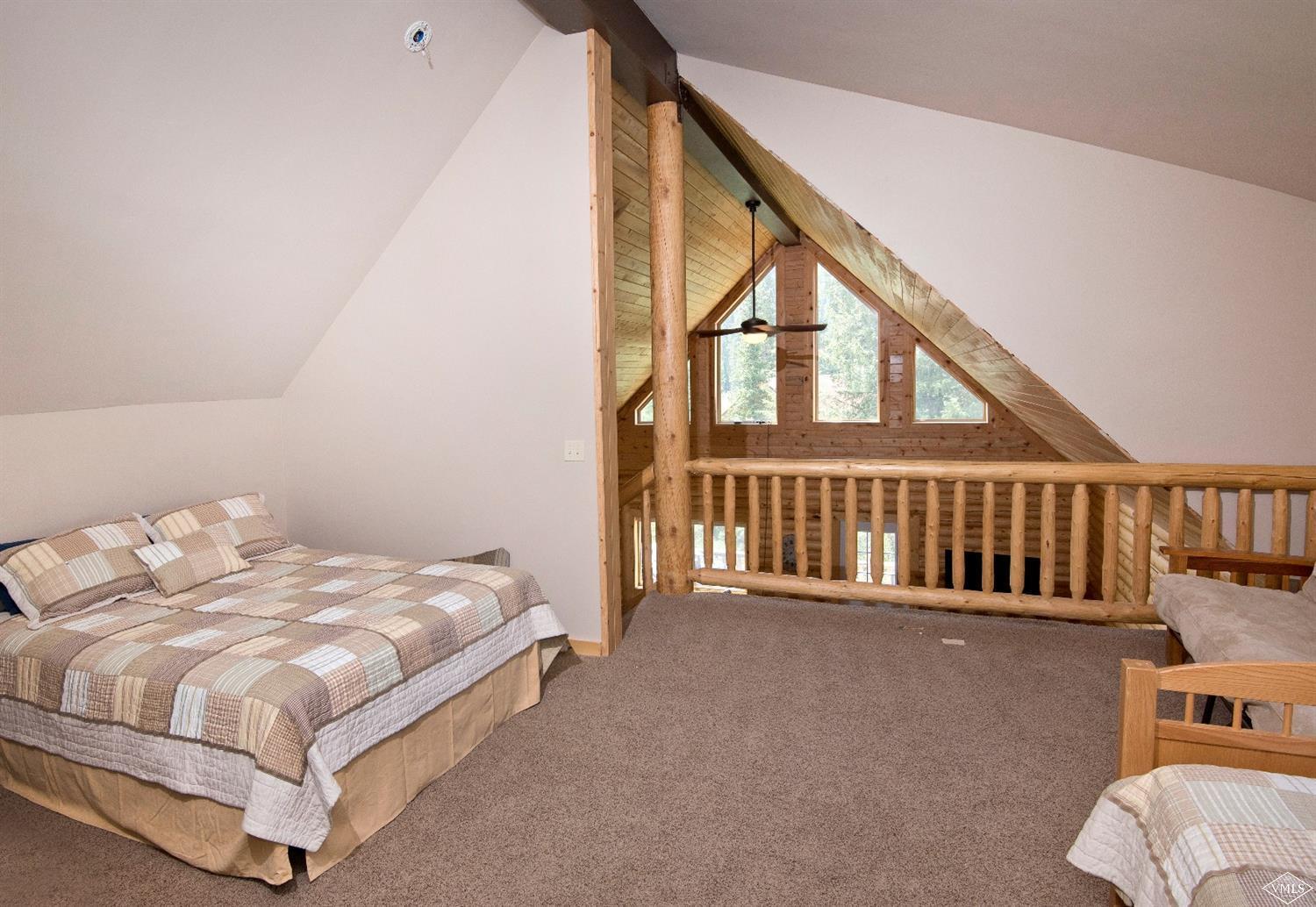 320 Mill Road Eagle, CO 81631 - Photo 15 of 24 a bed sitting in a bedroom next to a window