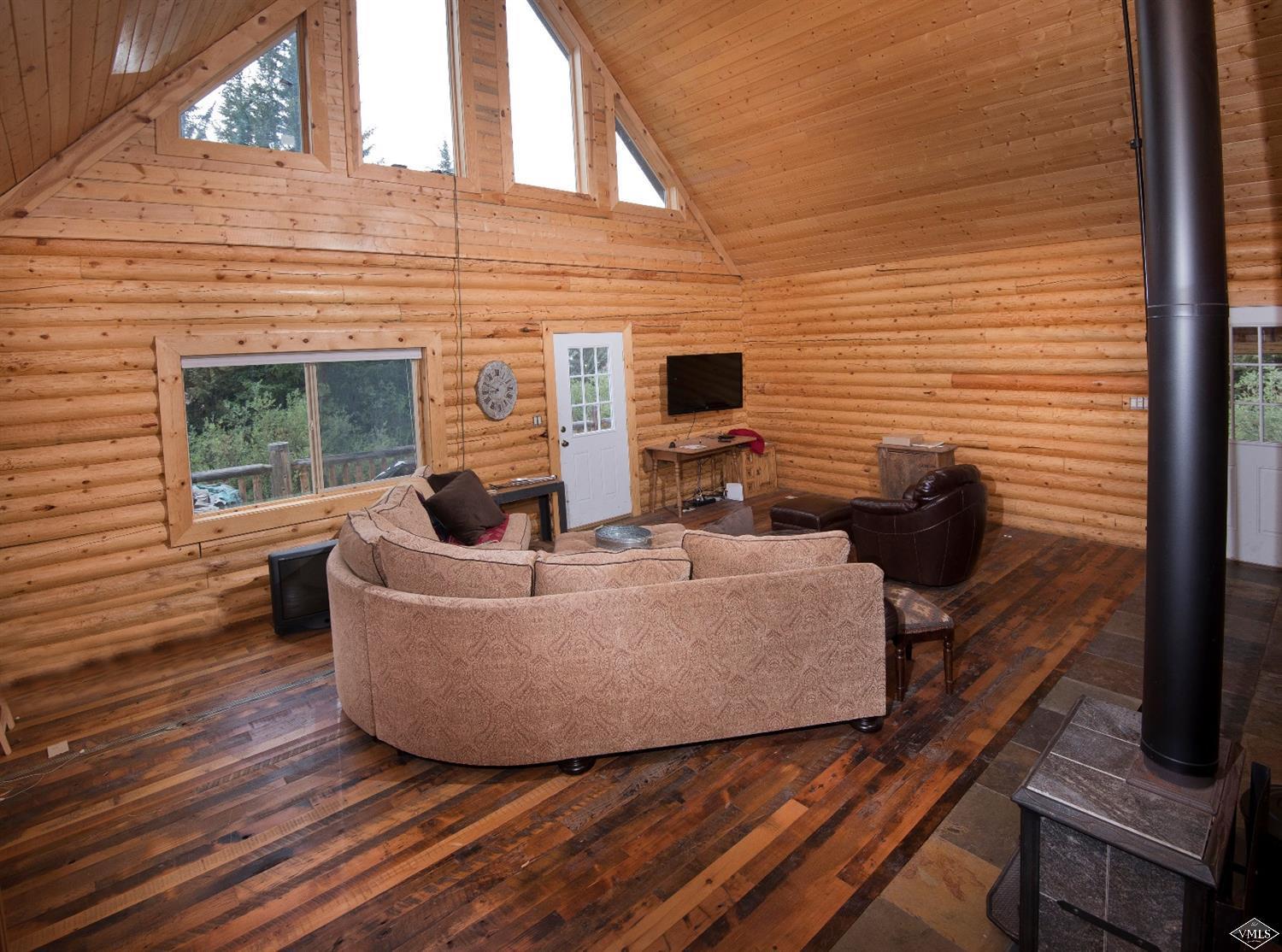 320 Mill Road Eagle, CO 81631 - Photo 5 of 24 a living room with furniture and a fireplace