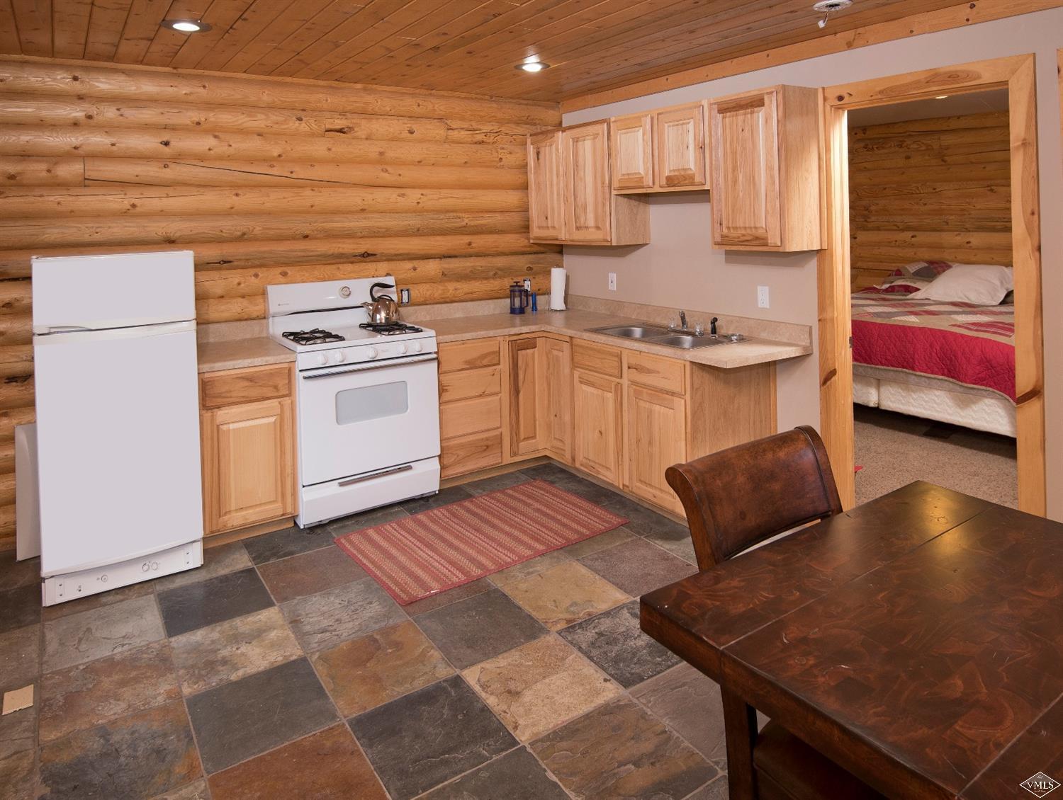 320 Mill Road Eagle, CO 81631 - Photo 10 of 24 a kitchen with a stove a sink and a refrigerator