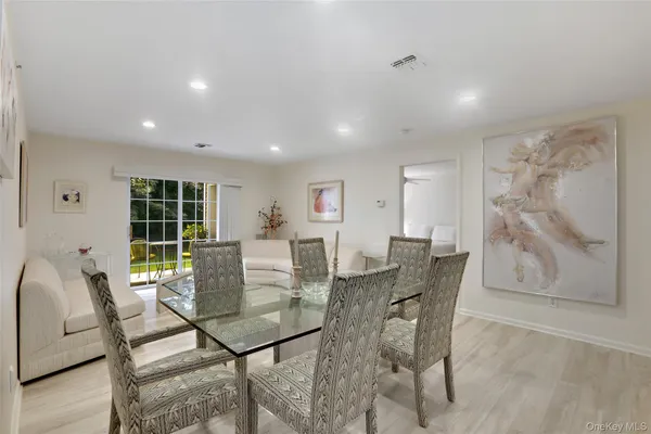 a view of a dining room with furniture and window