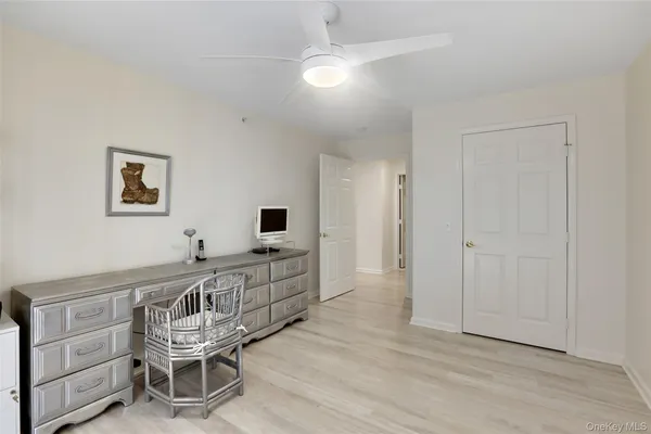 a very nice looking room with a wooden floor and furniture