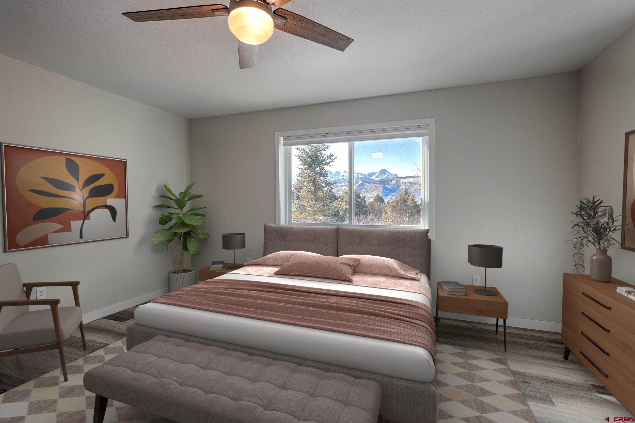 711 Terrace Drive Ridgway, CO 81432 - Photo 14 of 32 a bedroom with a bed and a window