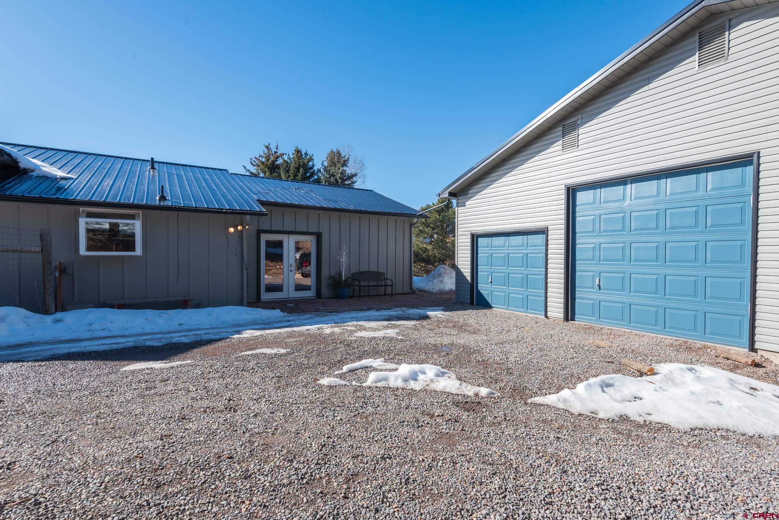 711 Terrace Drive Ridgway, CO 81432 - Photo 2 of 32 a view of a house with a patio