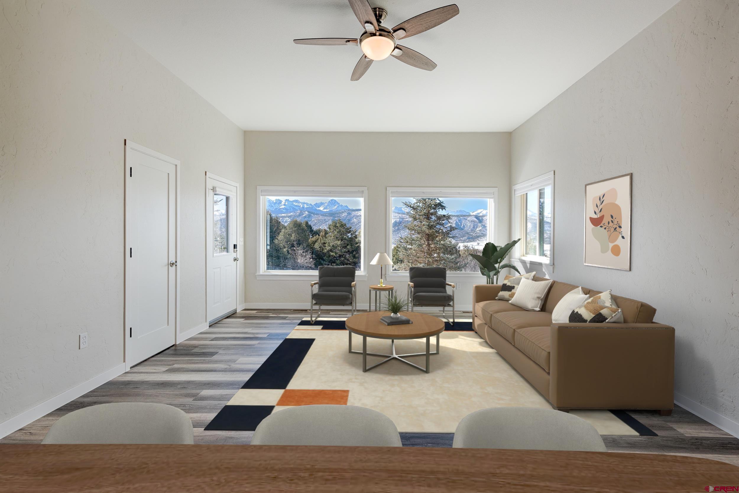 711 Terrace Drive Ridgway, CO 81432 - Photo 3 of 32 a living room with furniture and a large window