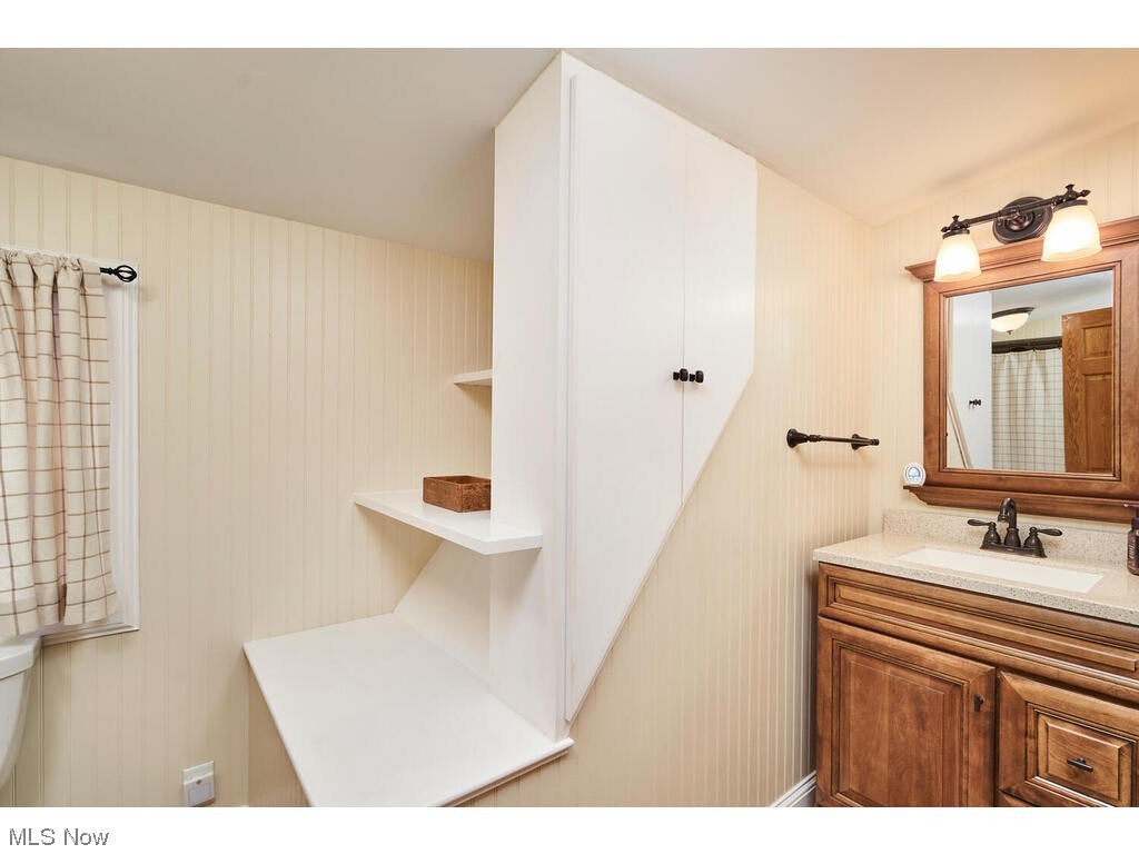 2483 West Comet Road Clinton, OH 44216 - Photo 7 of 30 Bathroom with vanity and toilet