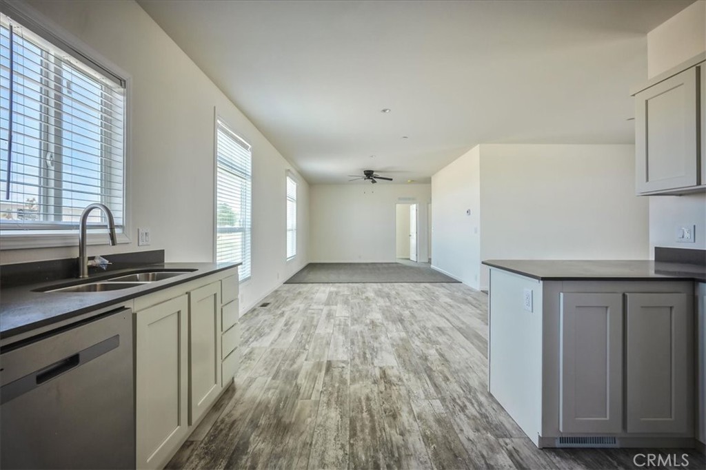12076 Lager Road Phelan, CA 92371 - Photo 11 of 30 a kitchen with granite countertop a sink and cabinets