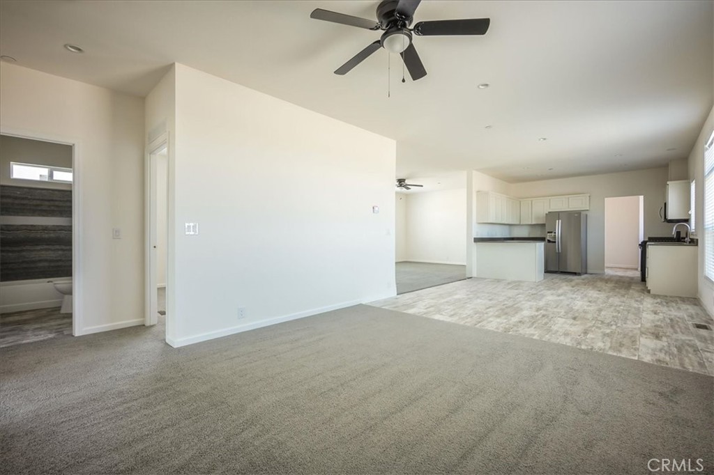 12076 Lager Road Phelan, CA 92371 - Photo 18 of 30 a big room with a kitchen and refrigerator