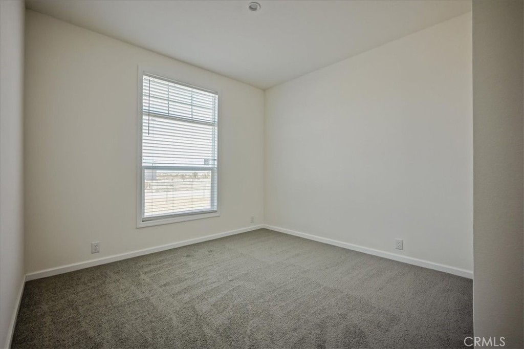 12076 Lager Road Phelan, CA 92371 - Photo 19 of 30 an empty room with a window