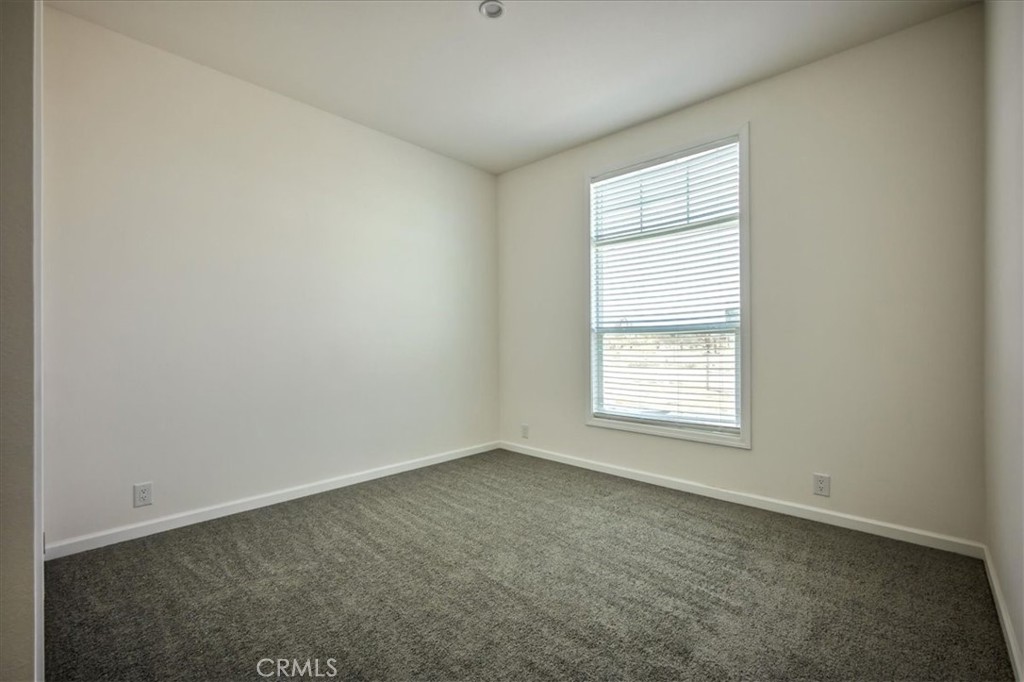 12076 Lager Road Phelan, CA 92371 - Photo 22 of 30 an empty room with a window