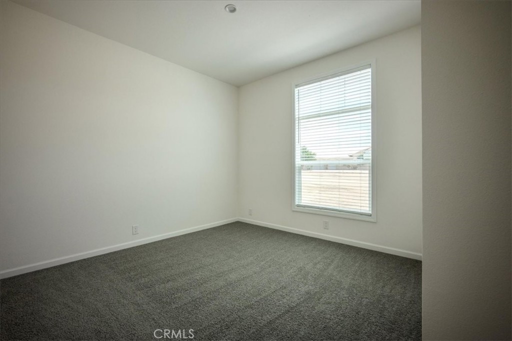 12076 Lager Road Phelan, CA 92371 - Photo 24 of 30 an empty room with a window