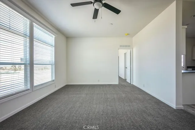 an empty room with a empty space and windows