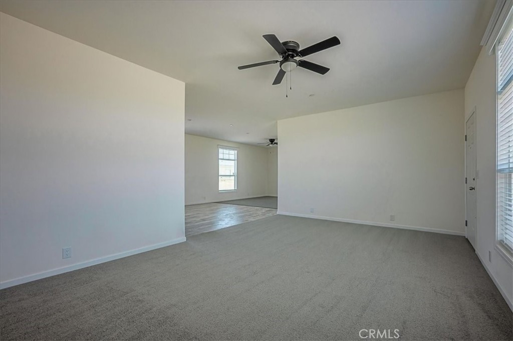 12076 Lager Road Phelan, CA 92371 - Photo 7 of 30 an empty room with a empty space and windows