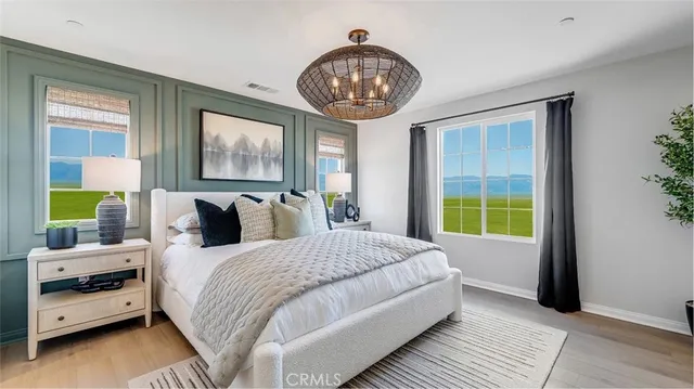 a bedroom with bed and a window