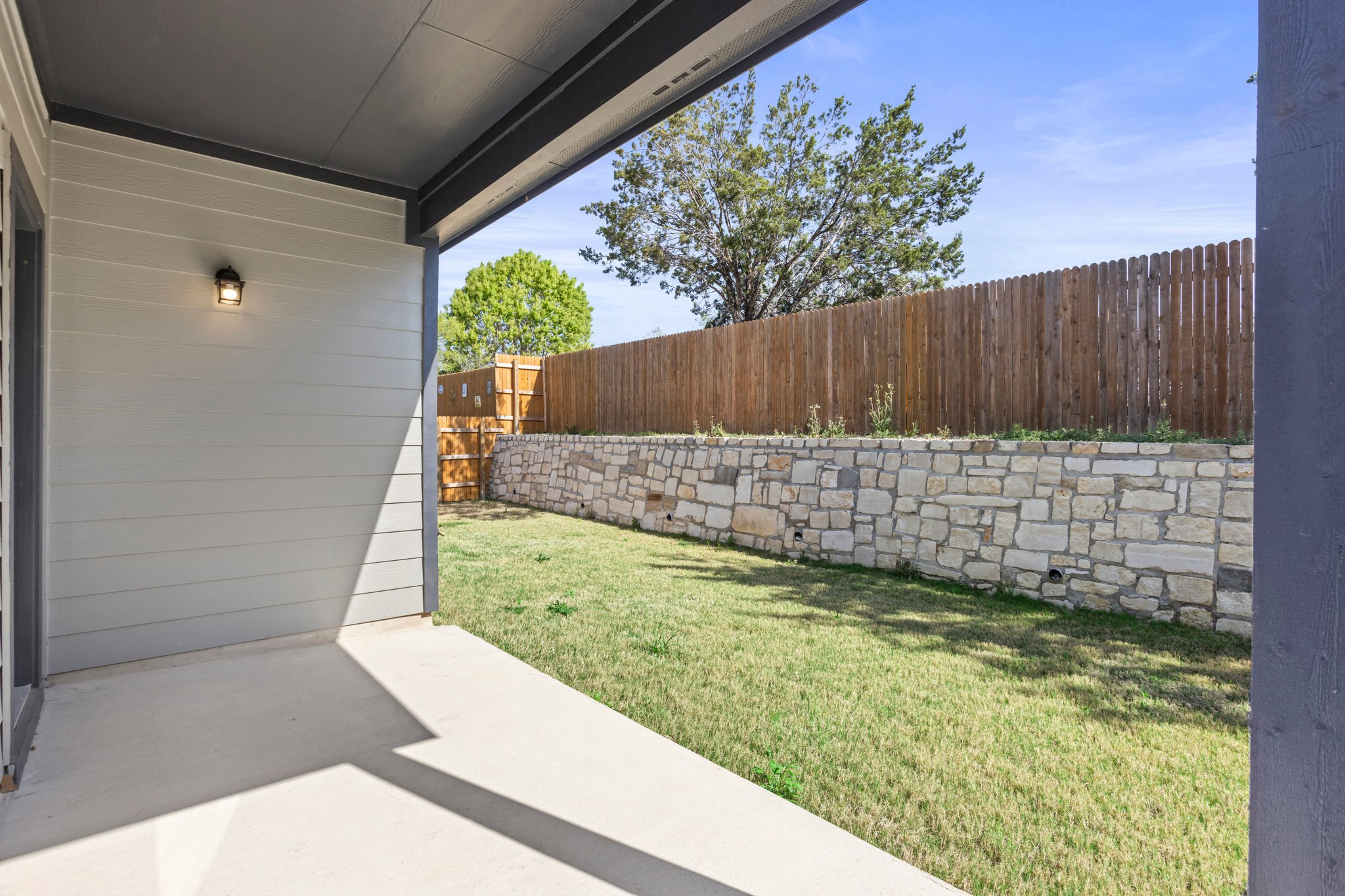 305 Brooks Ranch Drive Kyle, TX 78640 - Photo 32 of 32 a backyard of a house with lots of green space