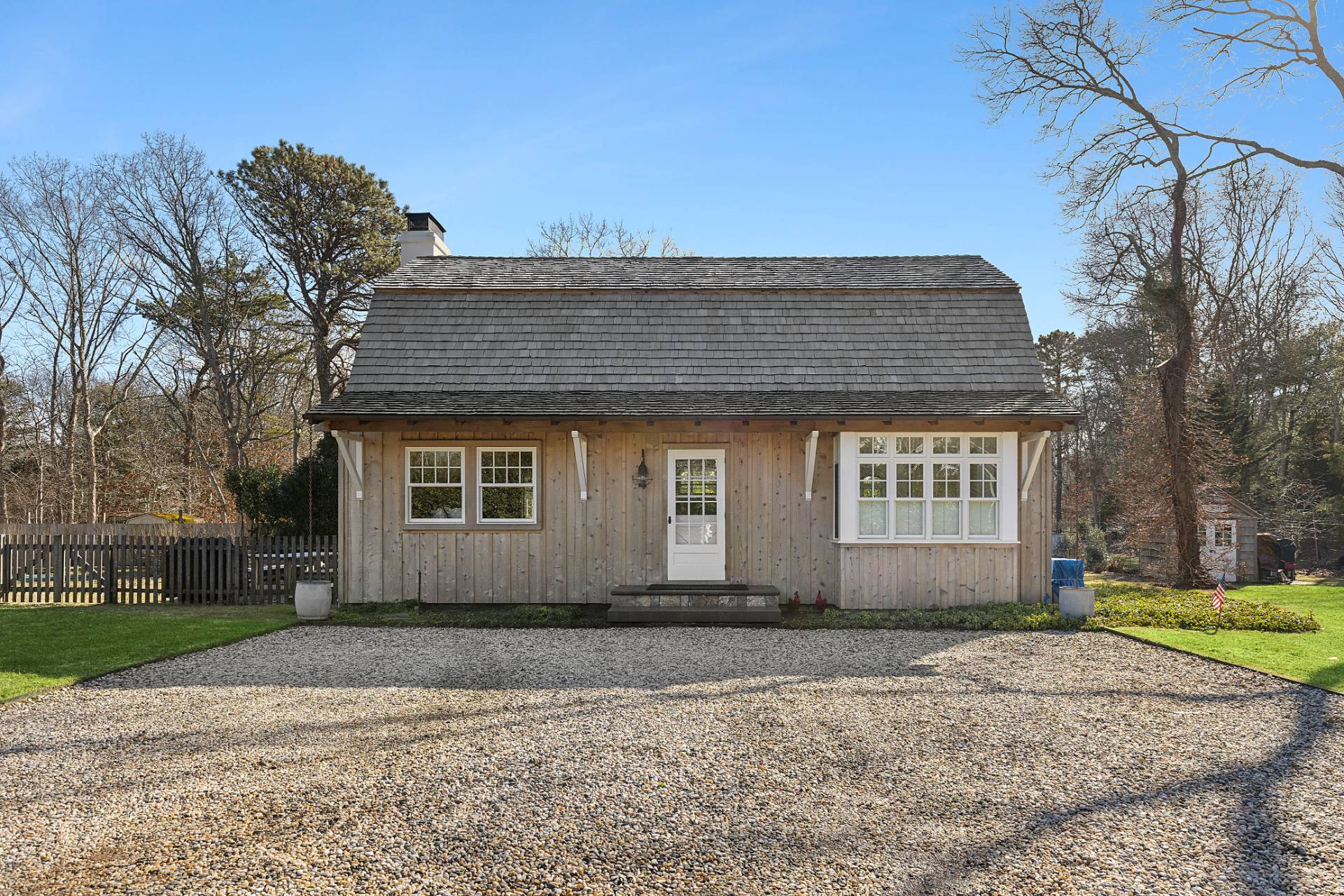 3 Fairfield Lane Wainscott, NY 11975 - Photo 11 of 14 a front view of a house with a yard and garage