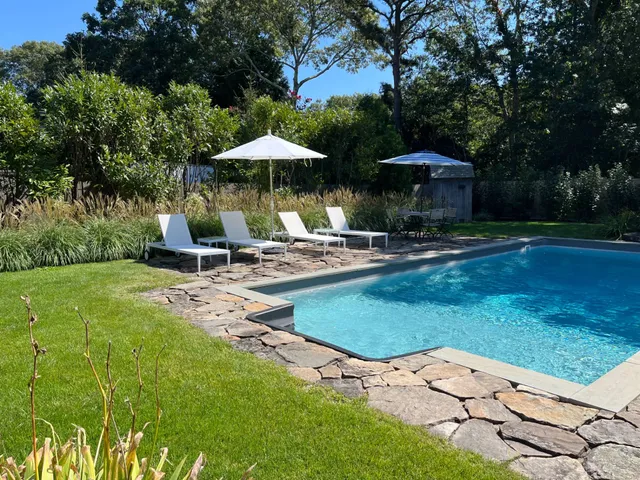 a garden view with a seating space