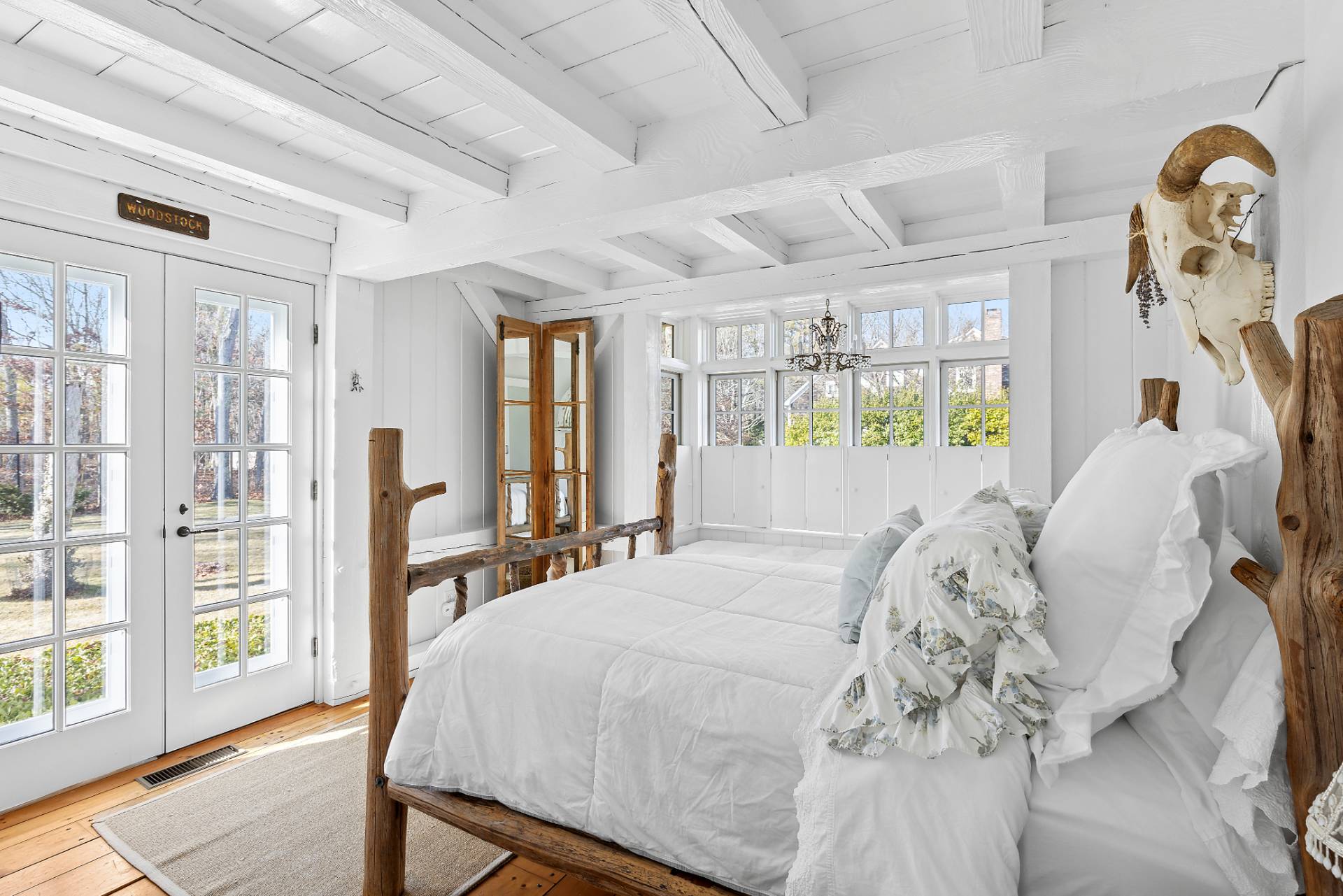 3 Fairfield Lane Wainscott, NY 11975 - Photo 7 of 14 a bedroom with a large bed and large windows