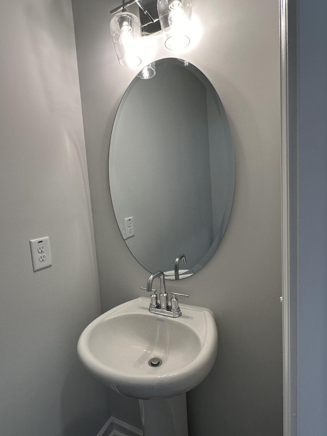 3114 Ranger Drive Durham, NC 27703 - Photo 15 of 33 a bathroom with a sink and a mirror