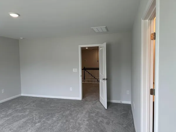 a view of an empty room and fire place