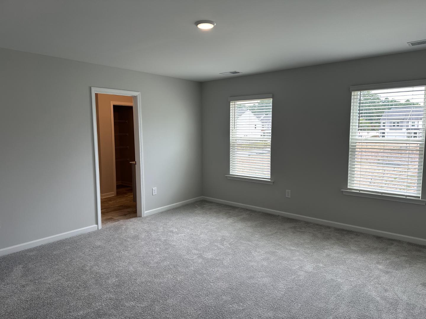 3114 Ranger Drive Durham, NC 27703 - Photo 18 of 33 an empty room with windows