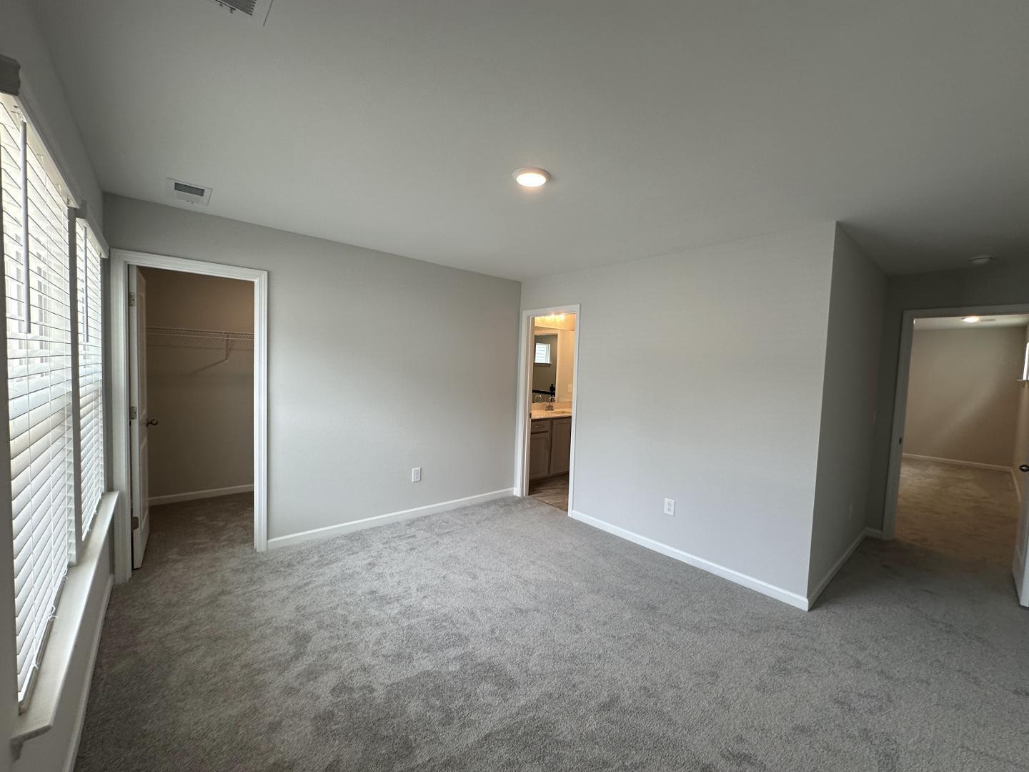 3114 Ranger Drive Durham, NC 27703 - Photo 23 of 33 an empty room with closet and windows