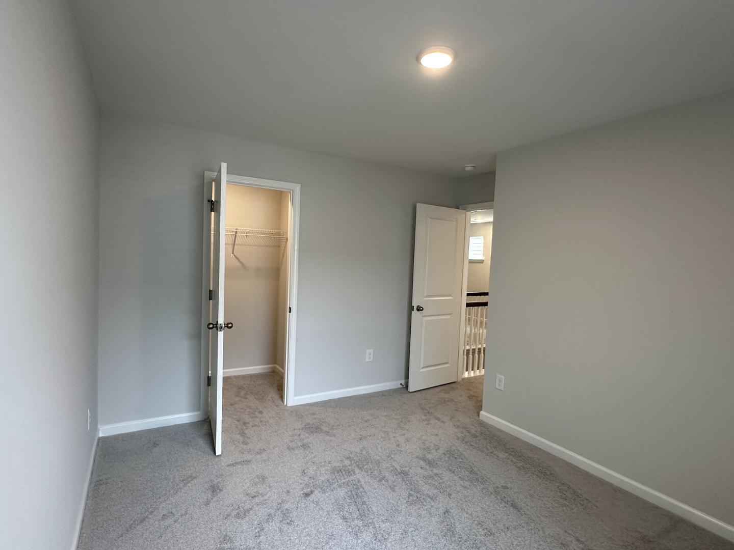 3114 Ranger Drive Durham, NC 27703 - Photo 24 of 33 an empty room with closet and mirror