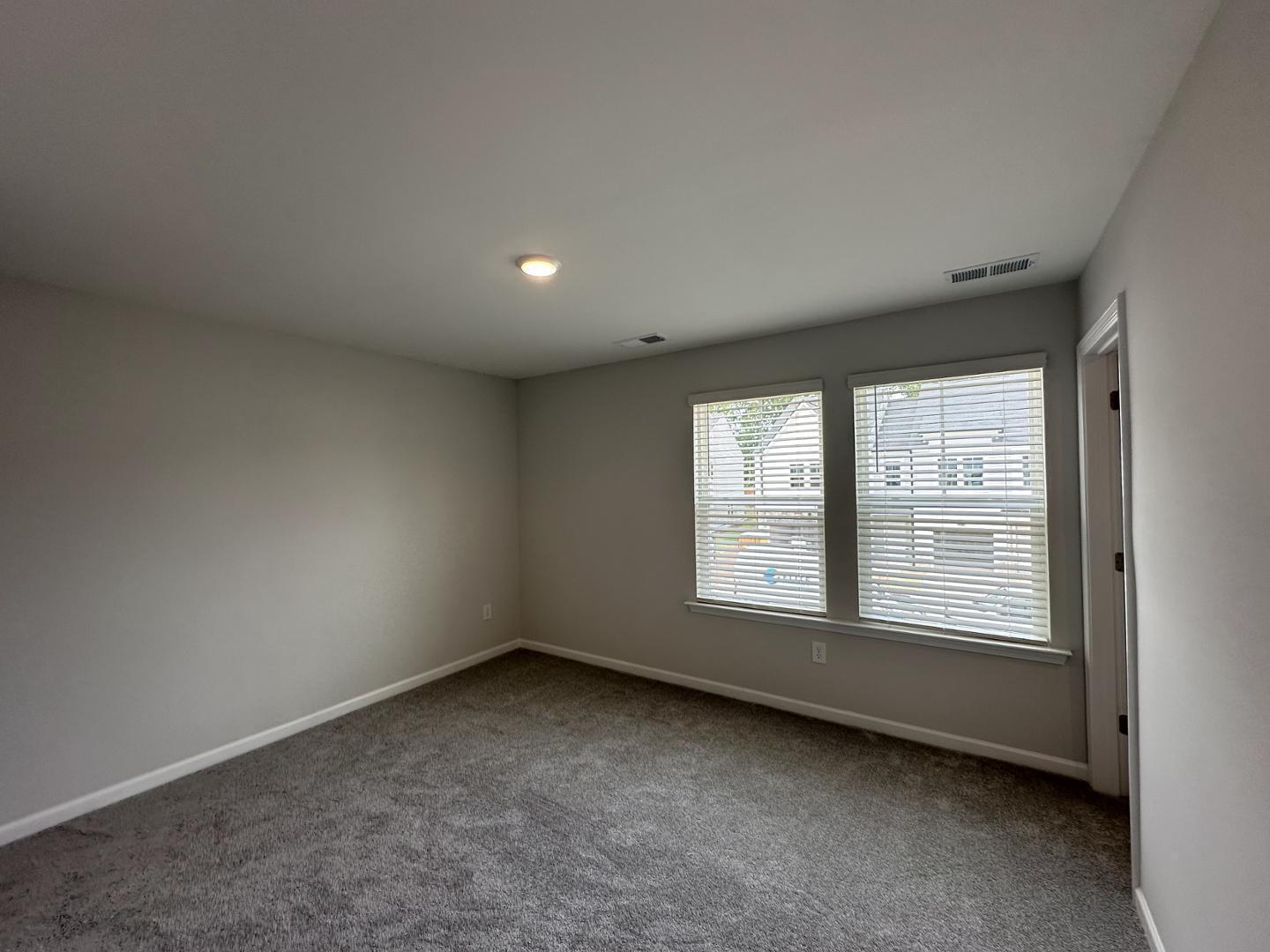 3114 Ranger Drive Durham, NC 27703 - Photo 25 of 33 a view of an empty room with a window