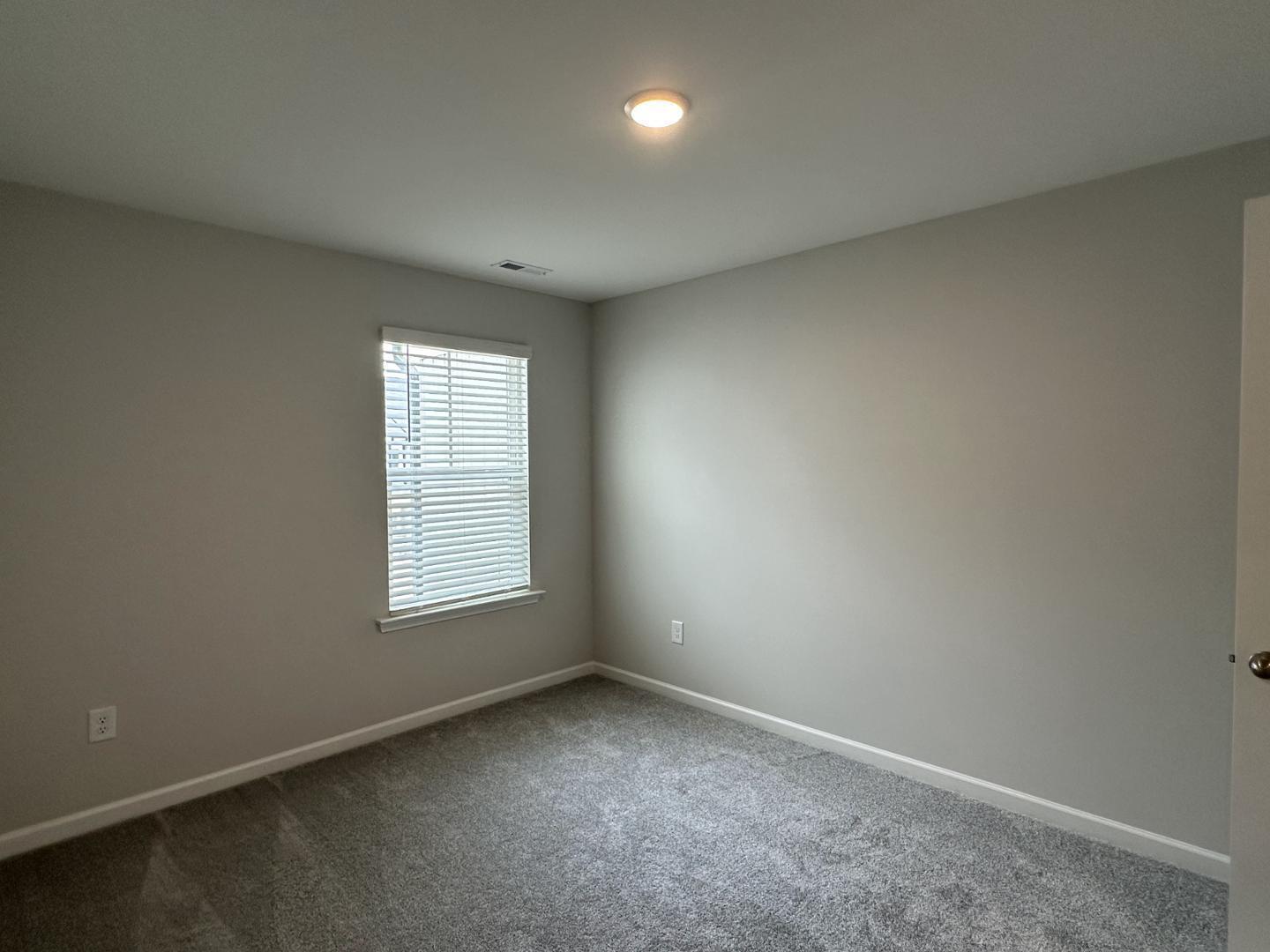 3114 Ranger Drive Durham, NC 27703 - Photo 26 of 33 an empty room with a window