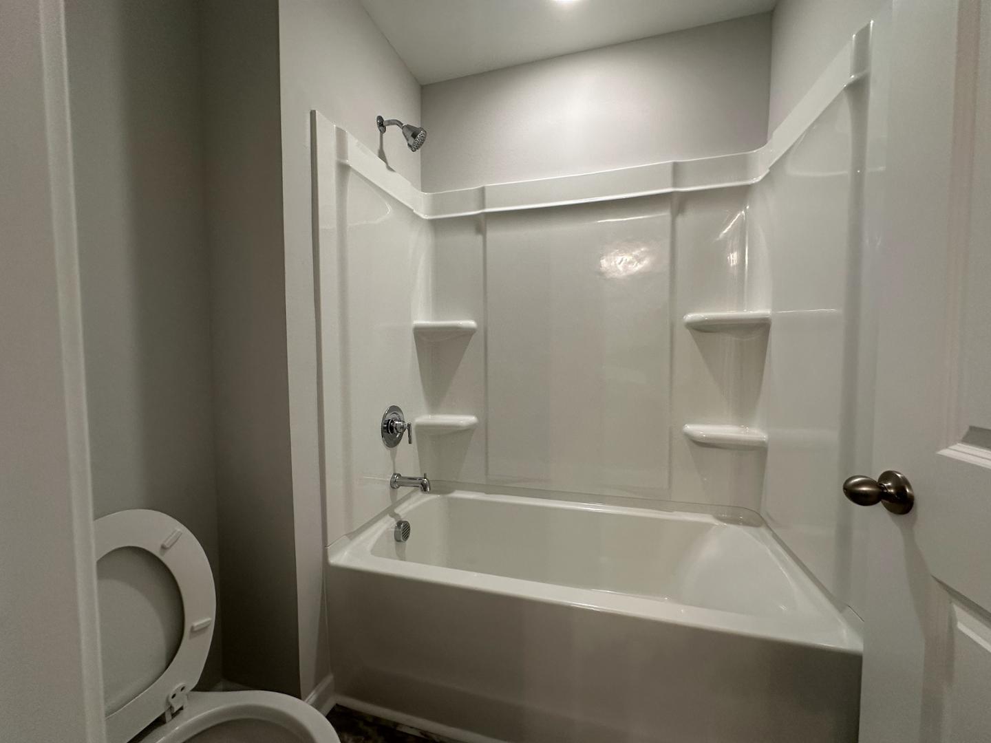 3114 Ranger Drive Durham, NC 27703 - Photo 28 of 33 a bathroom with a bathtub and a shower