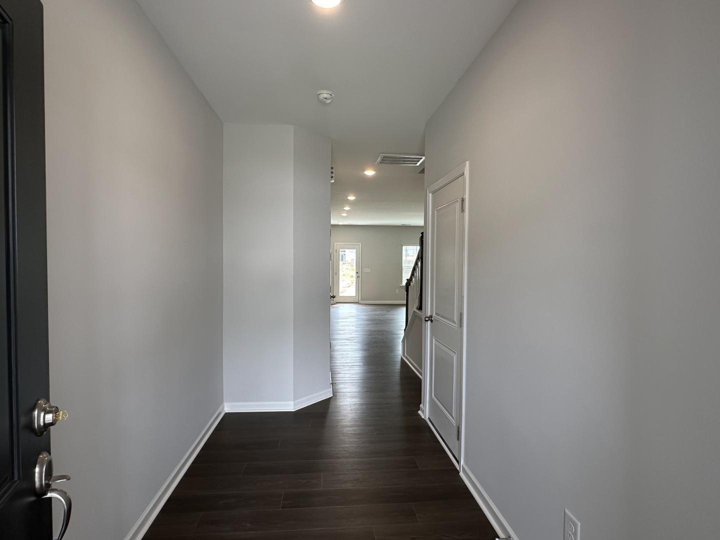 3114 Ranger Drive Durham, NC 27703 - Photo 5 of 33 a view of a hallway with wooden floor