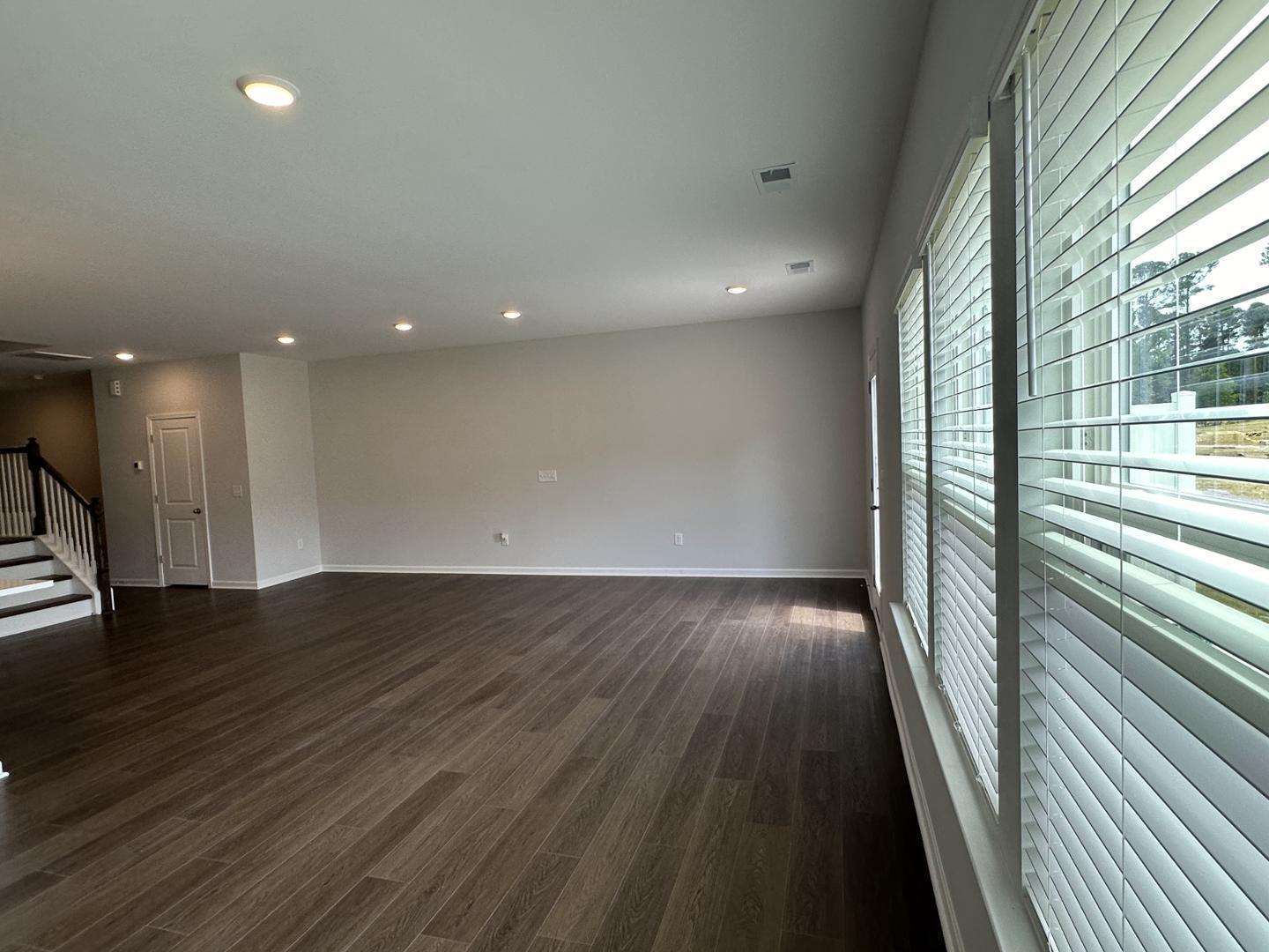 3114 Ranger Drive Durham, NC 27703 - Photo 8 of 33 wooden floor in an empty room with a window