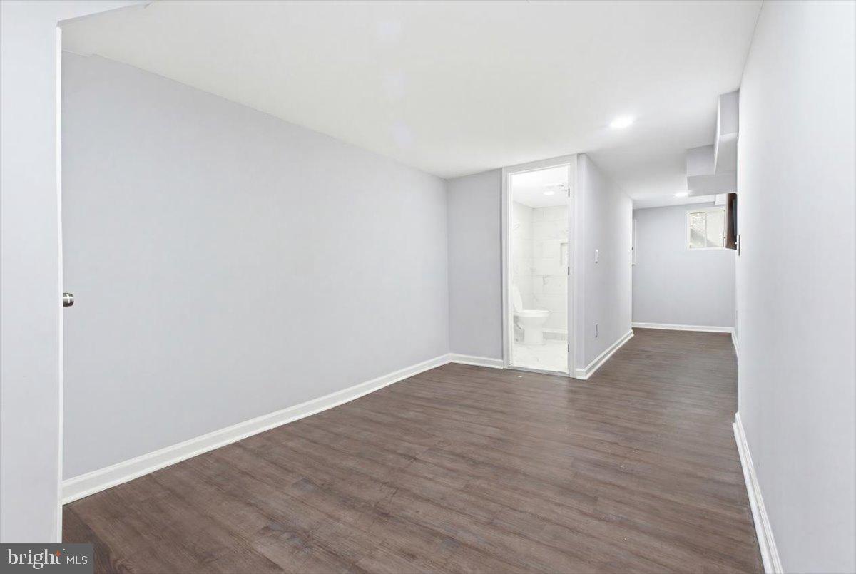 1231 North Potomac Street Baltimore, MD 21213 - Photo 21 of 25 a view of an empty room with wooden floor