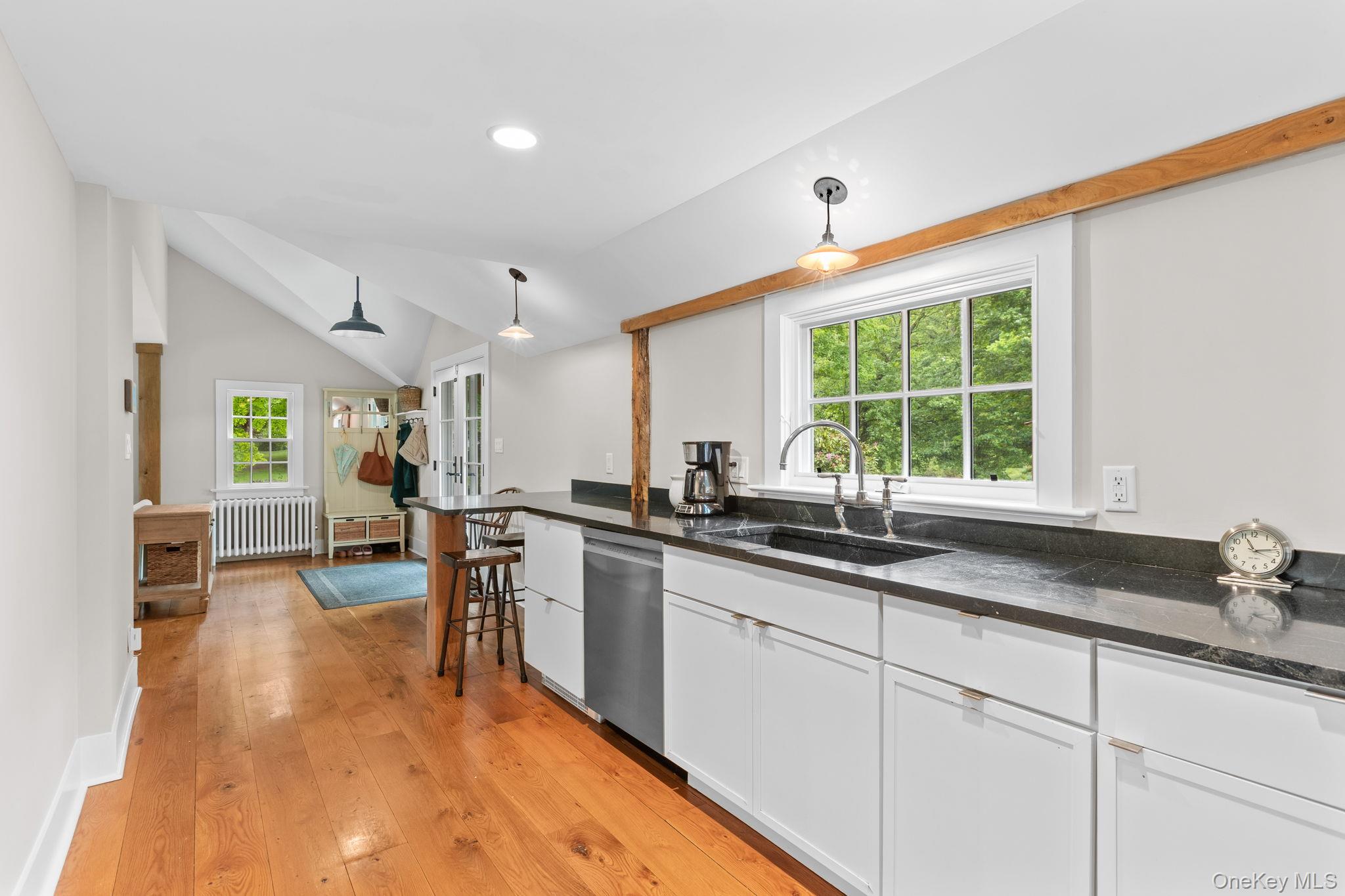 23 Pound Ridge Road Pound Ridge, NY 10576 - Photo 15 of 40 a kitchen with sink stove and cabinets
