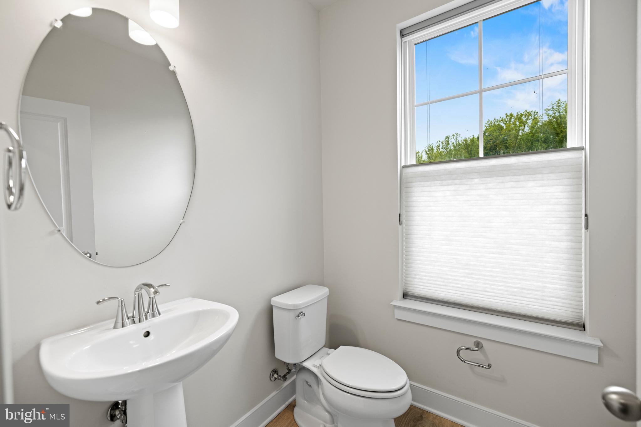 1548 Meadowlark Glen Road Dumfries, VA 22026 - Photo 22 of 48 a bathroom with a sink a mirror and a toilet