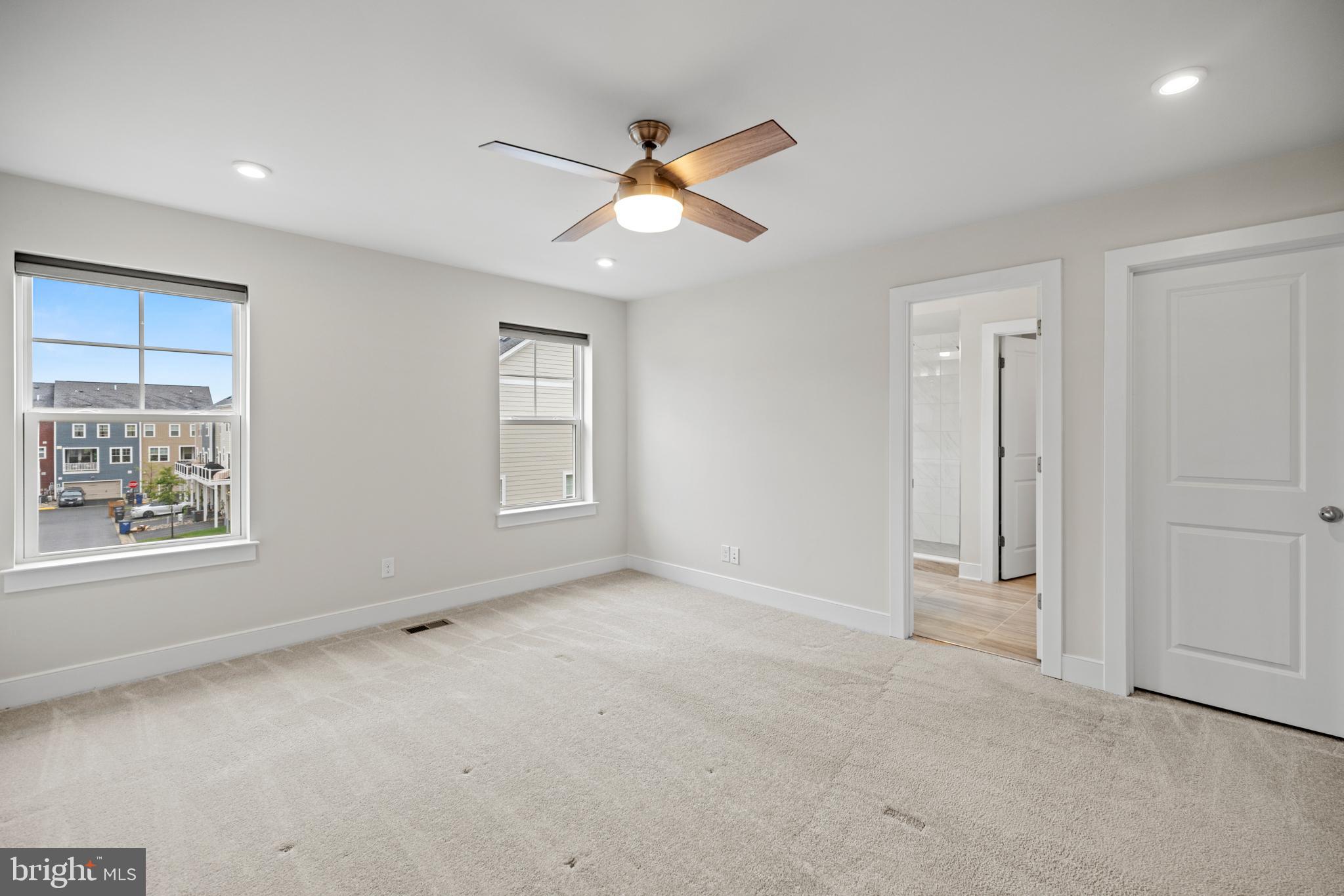 1548 Meadowlark Glen Road Dumfries, VA 22026 - Photo 25 of 48 an empty room with windows and fan