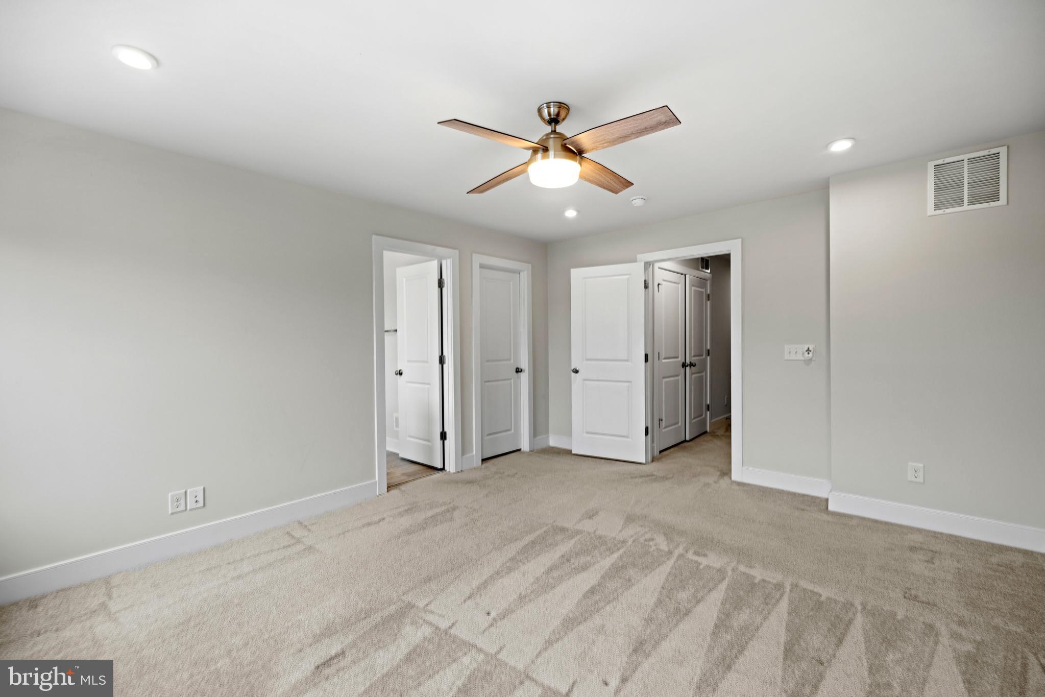 1548 Meadowlark Glen Road Dumfries, VA 22026 - Photo 26 of 48 an empty room with closet and windows