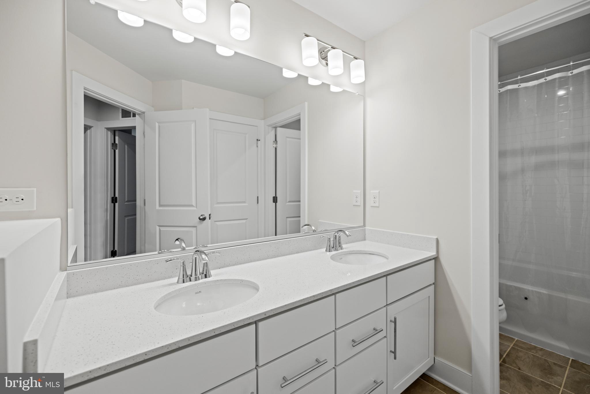 1548 Meadowlark Glen Road Dumfries, VA 22026 - Photo 31 of 48 a bathroom with a sink vanity granite and a mirror
