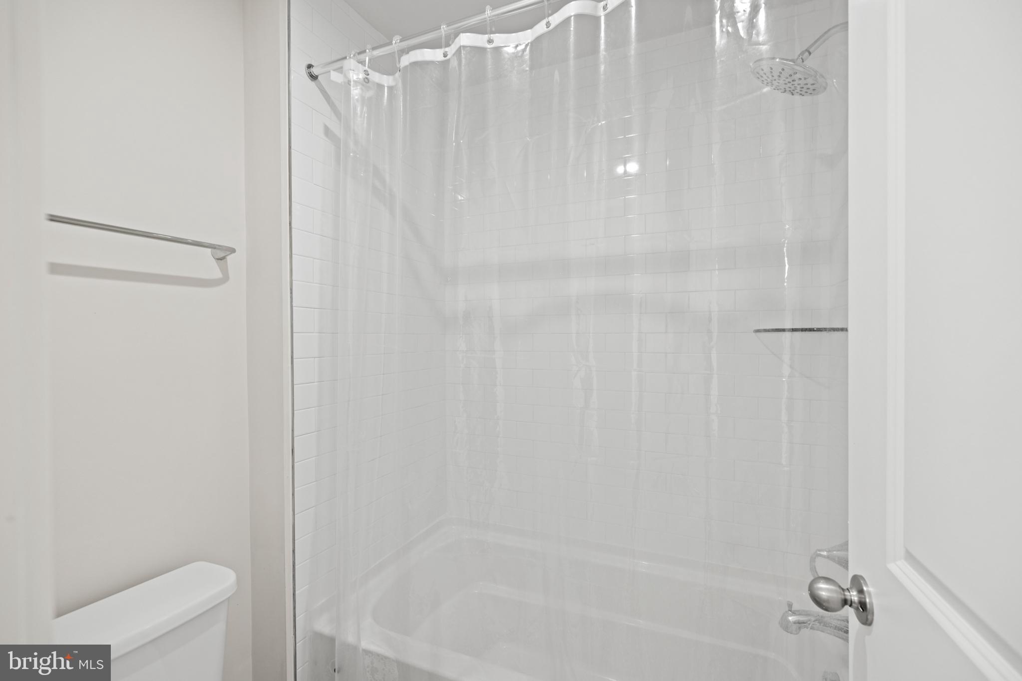 1548 Meadowlark Glen Road Dumfries, VA 22026 - Photo 32 of 48 a bathroom with a shower and a toilet