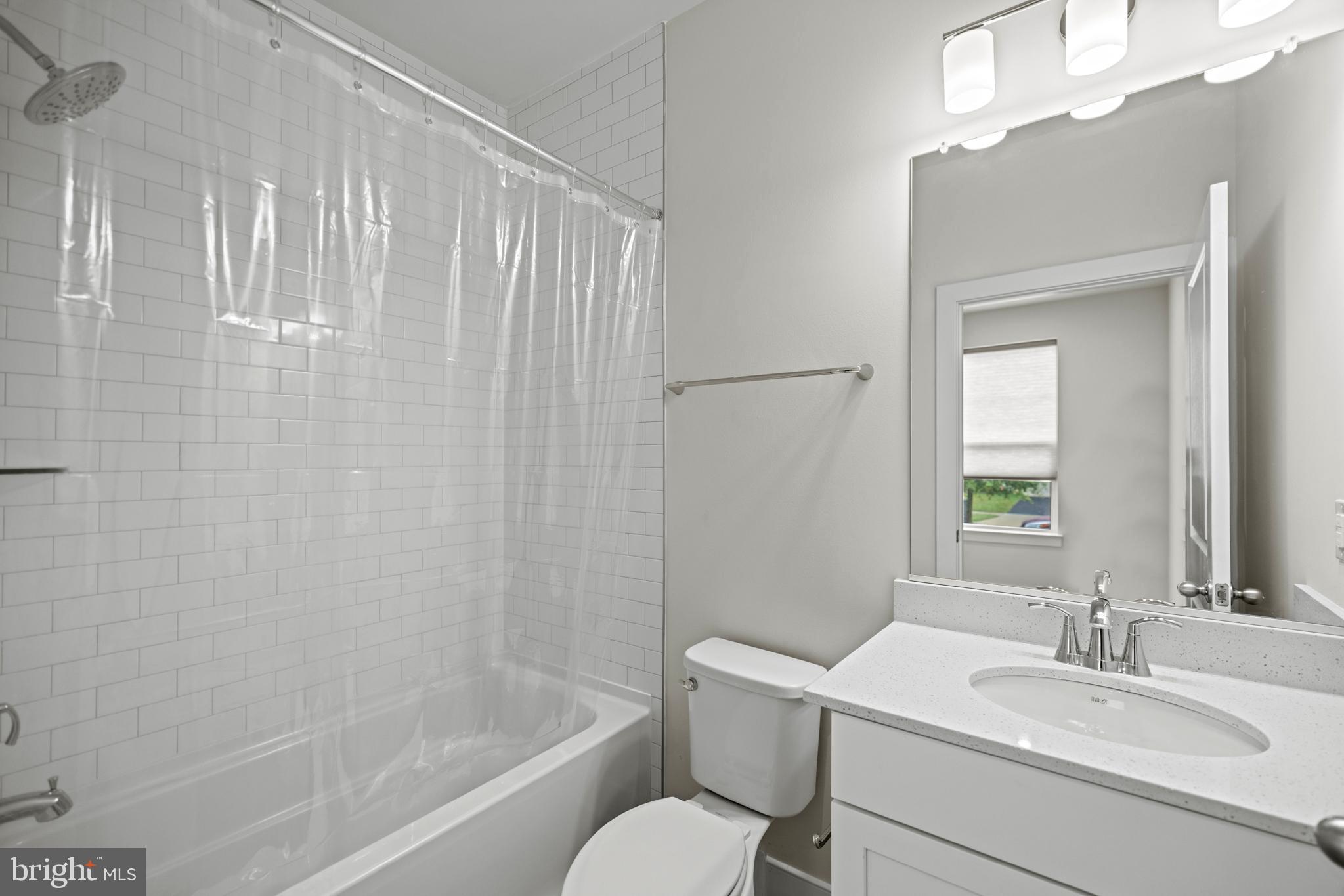1548 Meadowlark Glen Road Dumfries, VA 22026 - Photo 4 of 48 a bathroom with a sink toilet a mirror and shower