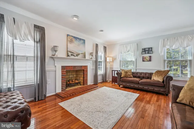 a large kitchen with stainless steel appliances granite countertop a stove sink and cabinets