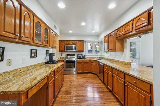 a view of a dining room with furniture and a chandelier