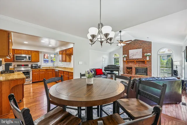 a living room with furniture a rug and a fireplace