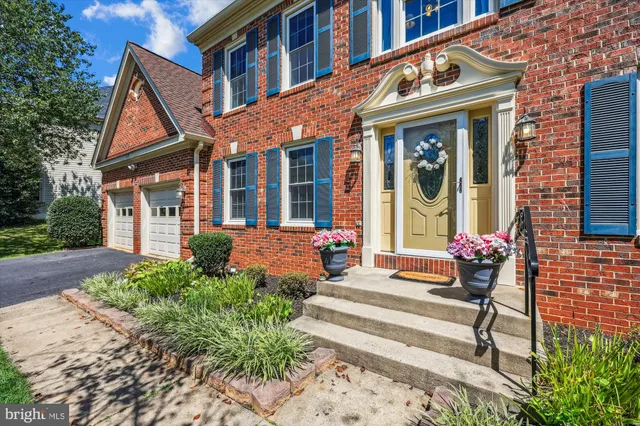 a view of a livingroom with wooden floor and a large window