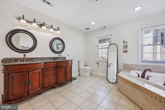 a view of a patio with a table and chairs under an umbrella