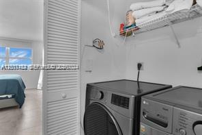 90 Alton Road, Unit 2303 Miami Beach, FL 33139 - Photo 25 of 29 a close view of a utility room with dryer and washer