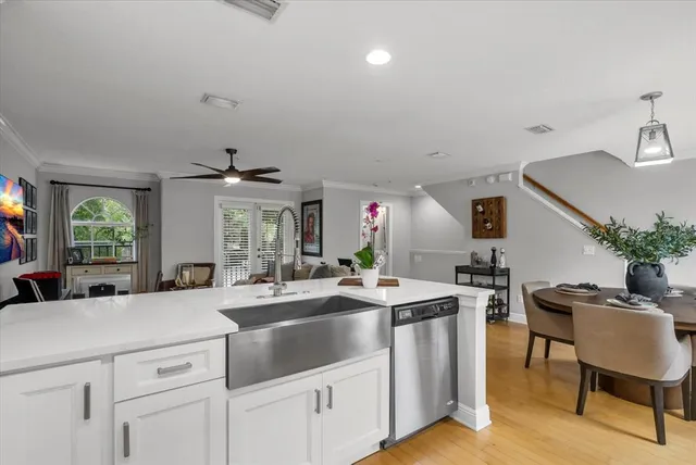 a kitchen with sink cabinets and stove