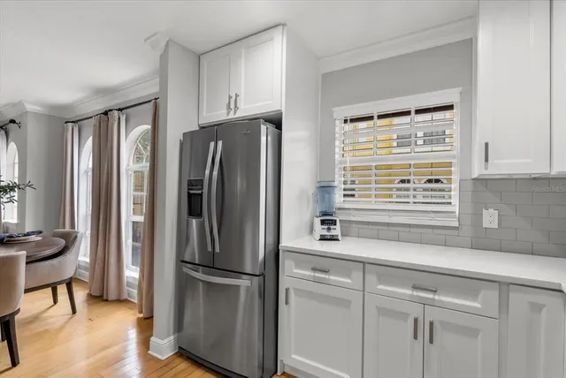 a kitchen with stainless steel appliances a refrigerator and a sink
