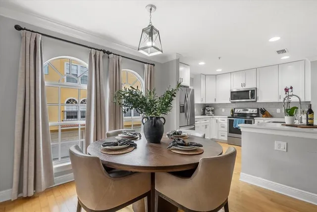 a kitchen with a table and chairs in it