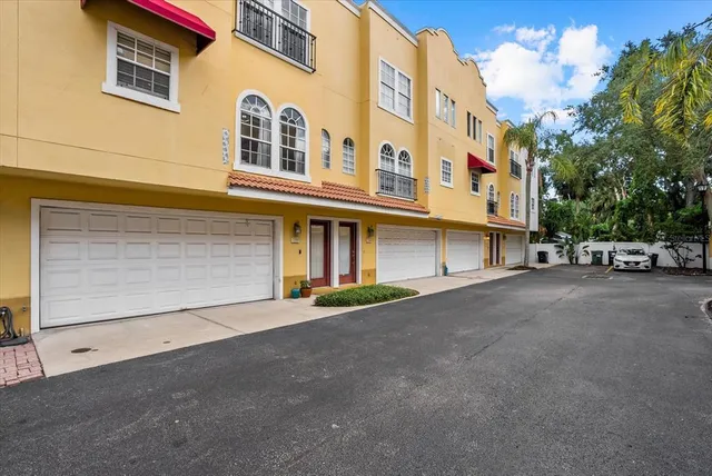a view of a building with car parked